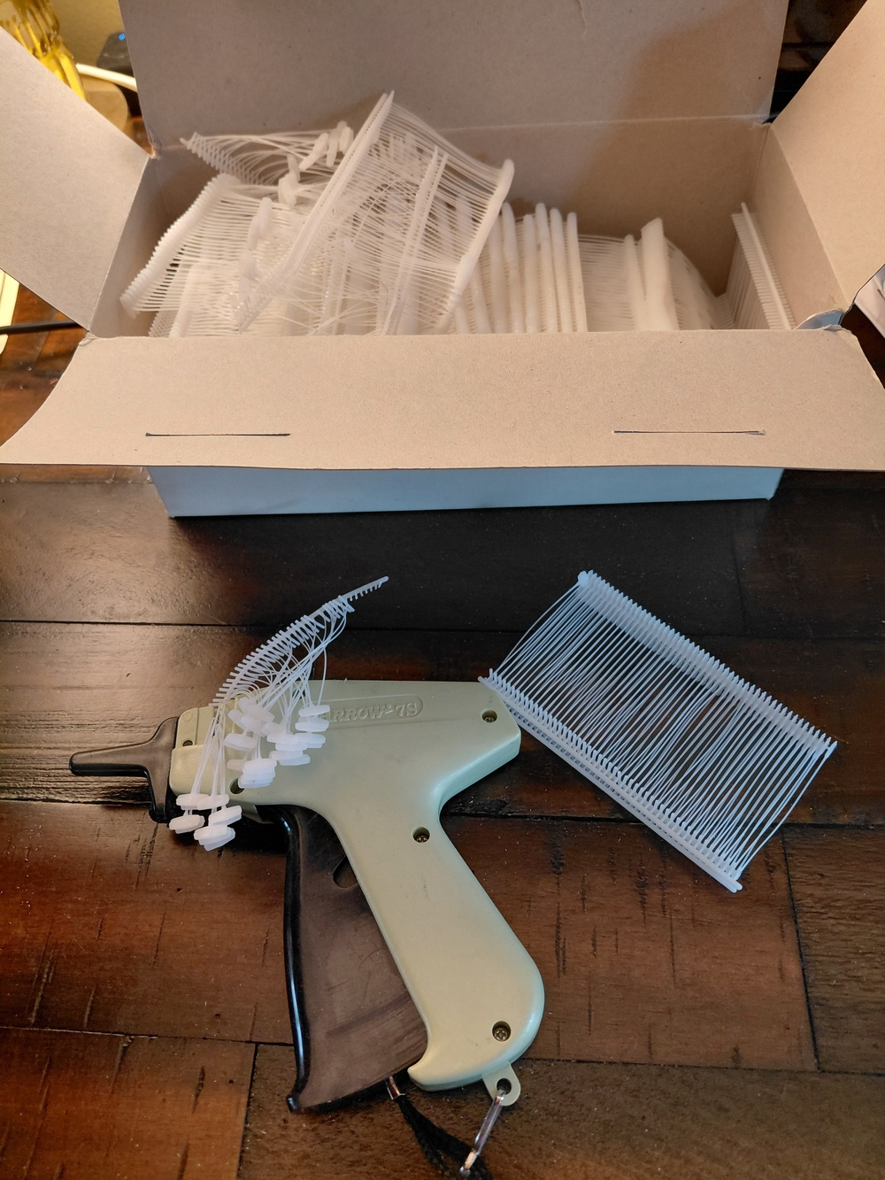 Tagging Gun with White Fastener Collars